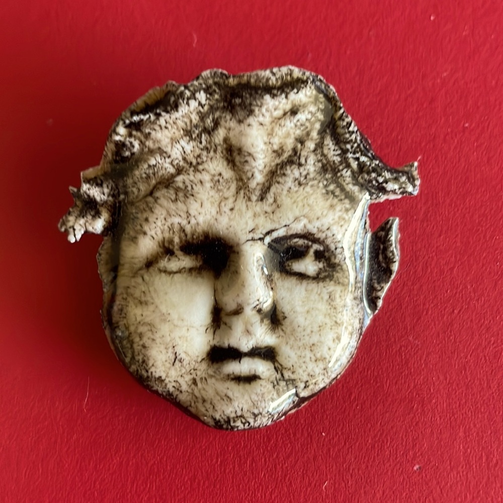 Funky cherub pin